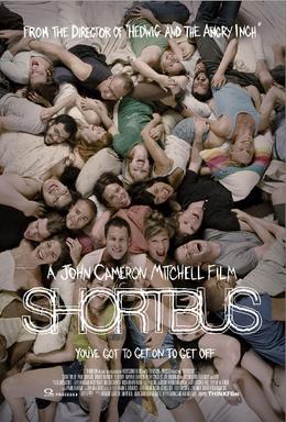 The poster features the ensemble lying on the floor smiling towards the audience. The page is filled up with clothed bodies.